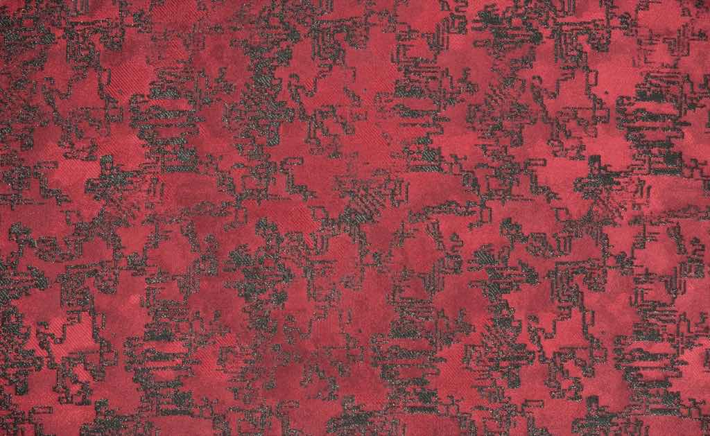Dekorationsstoff mit einem Allover-Jacquarddessin, das an abstrakte asiatische Schriftzeichen erinnert. Dekorationsstoff mit einem Allover-Jacquarddessin, das an abstrakte asiatische Schriftzeichen erinnert.